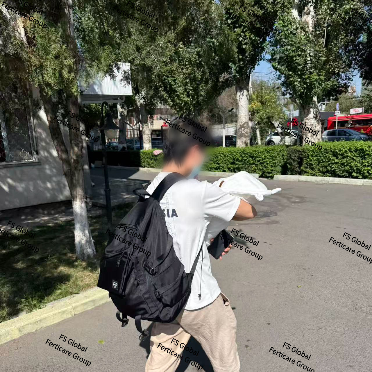 A client carries the baby out of the hospital.