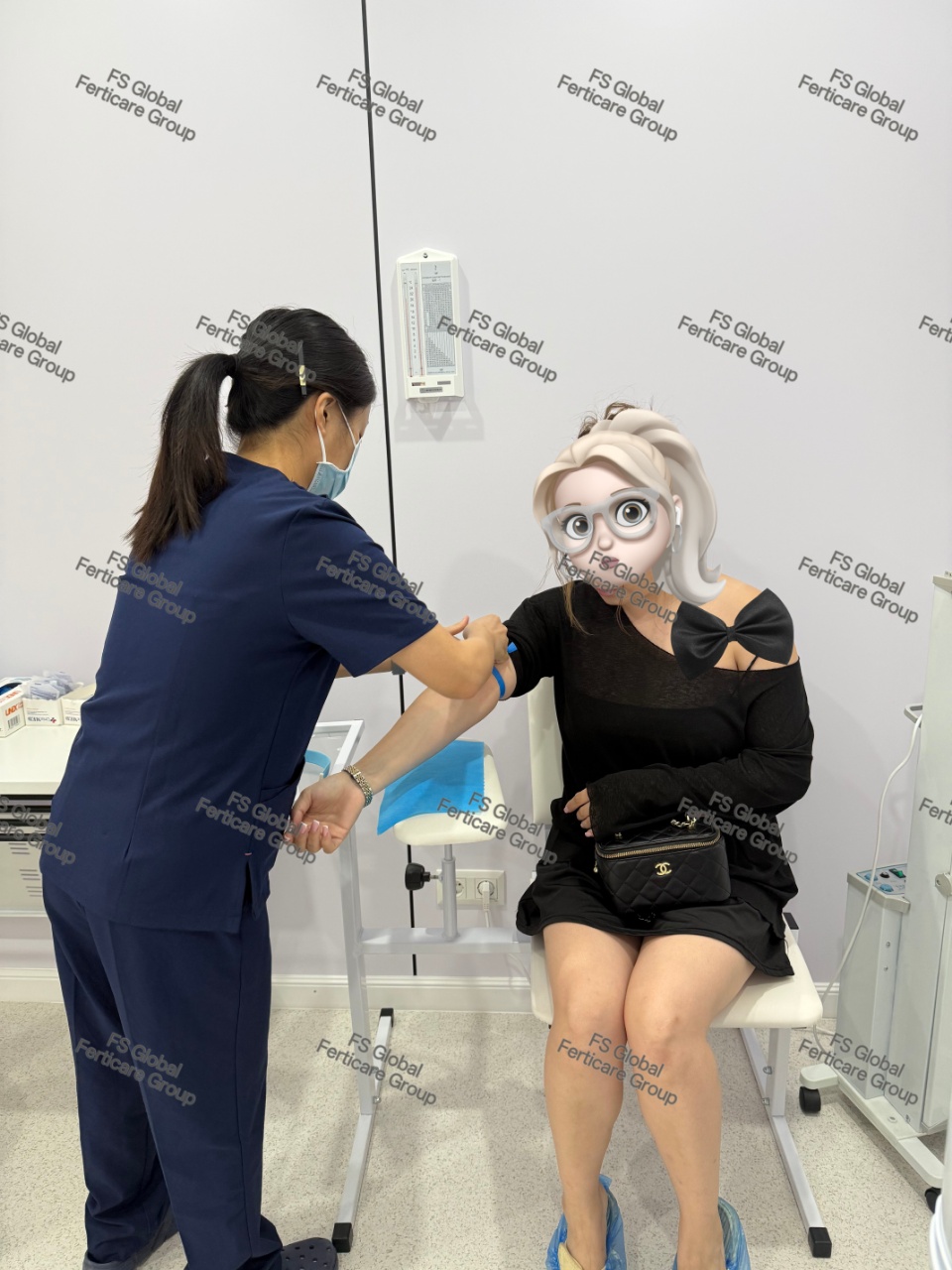 The second client completes blood collection.