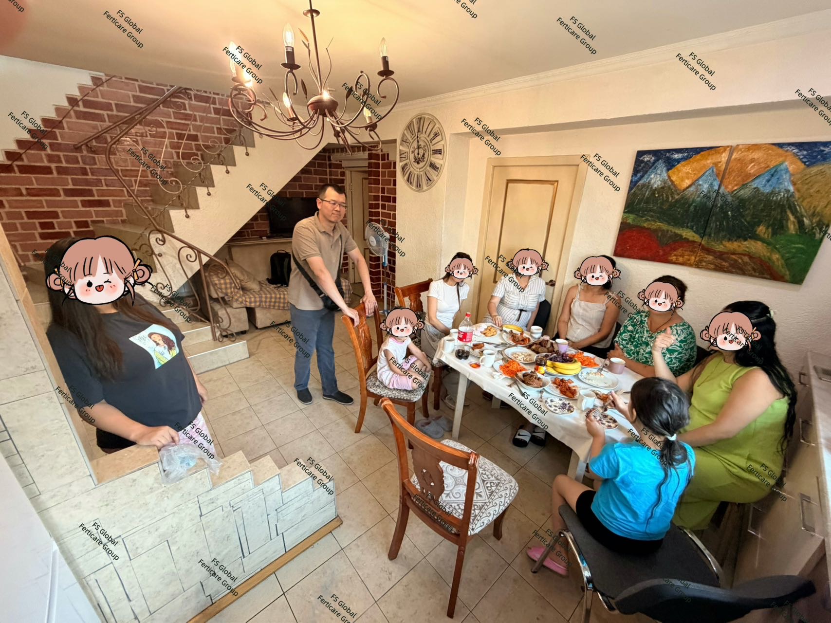 Volunteers and staff share a meal around the table.